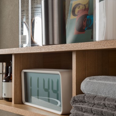 A shelf with towels and care products